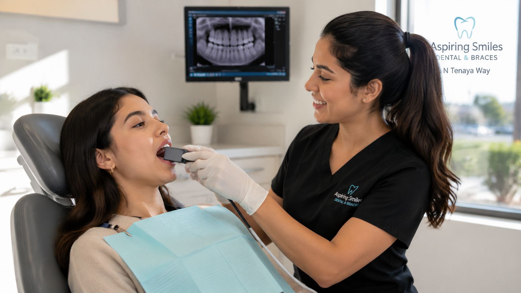 A friendly dental assistant taking digital x-rays for a patient in a modern dental office setting.