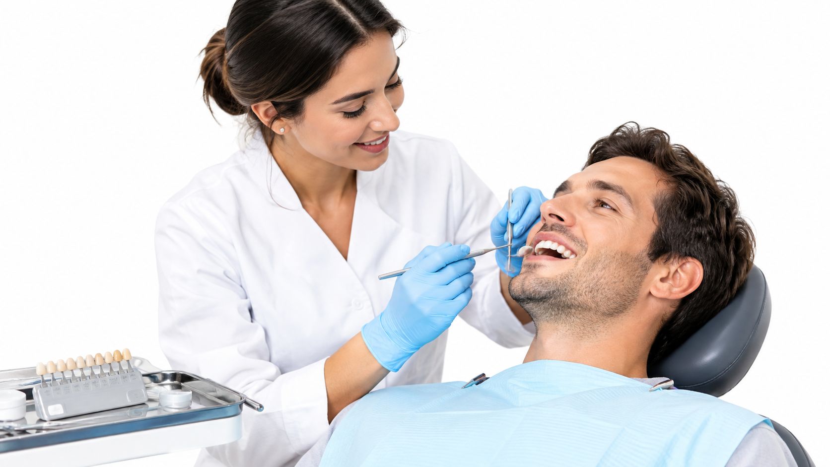 A smiling female dentist examining a male patient's teeth while using a metal mirror in a clinic.