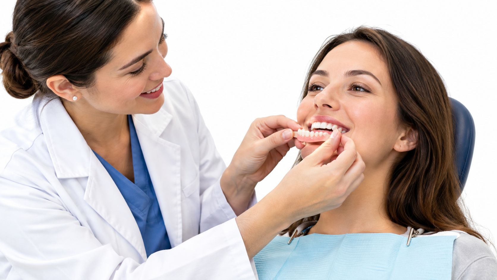 A female dentist assisting a patient with a wax try-in for a new set of dentures